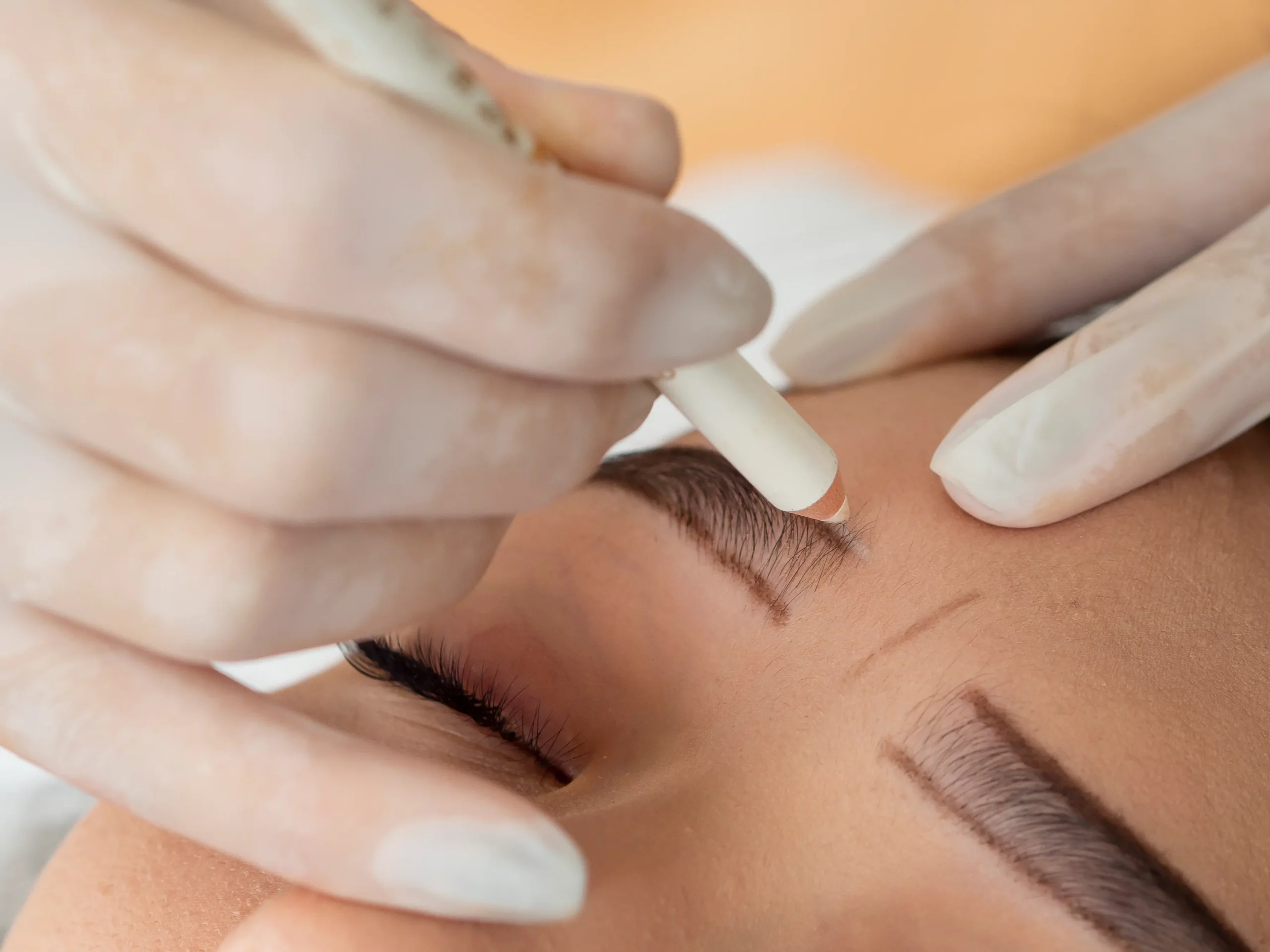 client going through microblading treatment 1 scaled